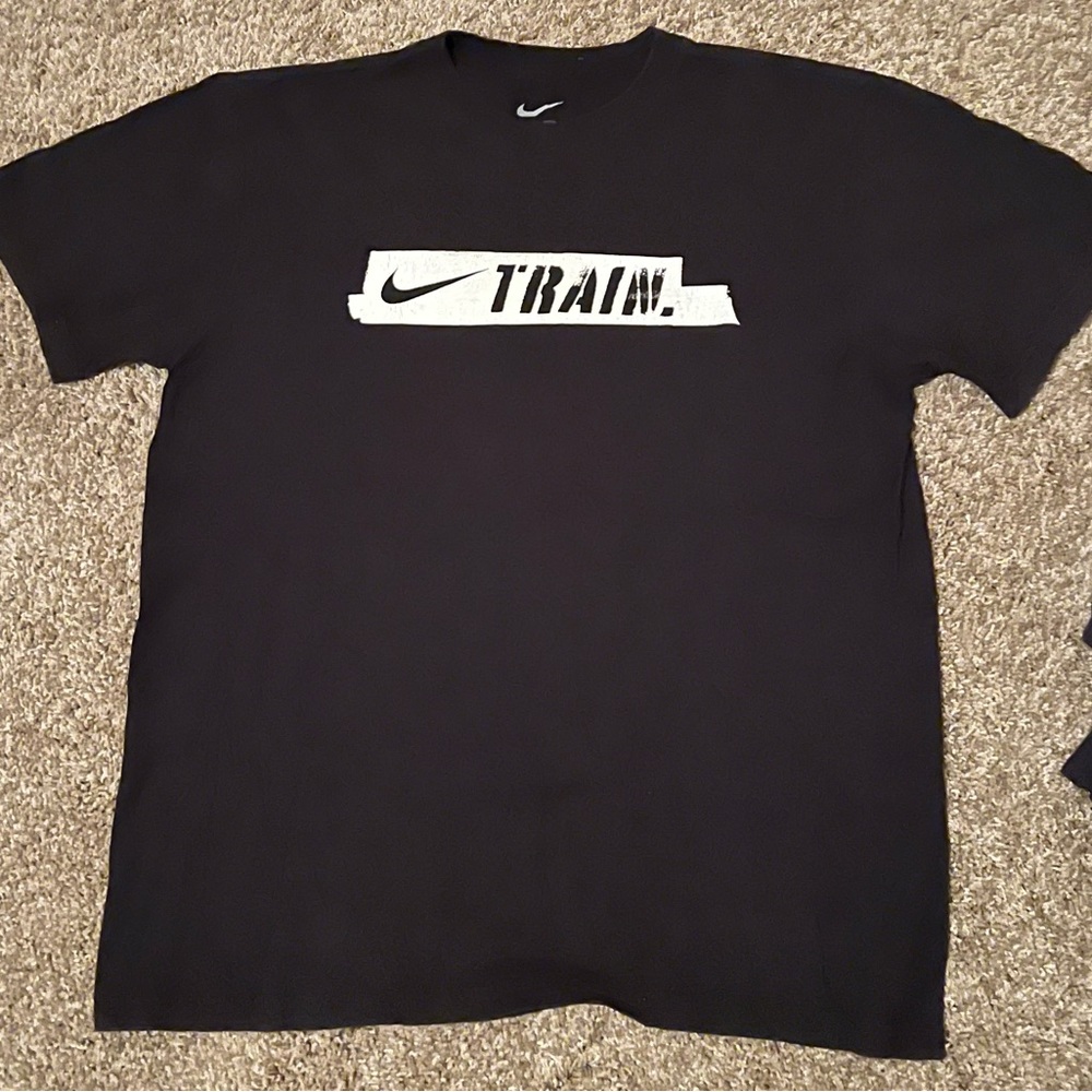 Black Nike t-shirt with “train” and the Nike logo on the front